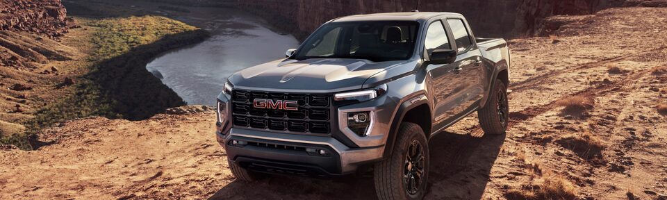 The Canyon Elevation Parked on a Cliff Side with a Mountain & Lake Backdrop