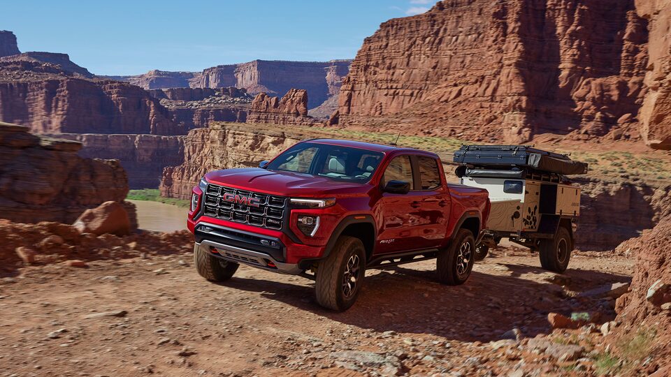 The GMC Canyon AT4 Driving Off-Road Kicking up Dirt