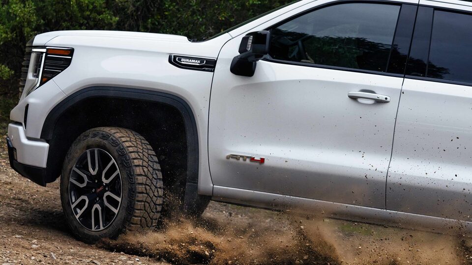The Sierra AT4 Kicking Up Dirt on an Off-Road Trail