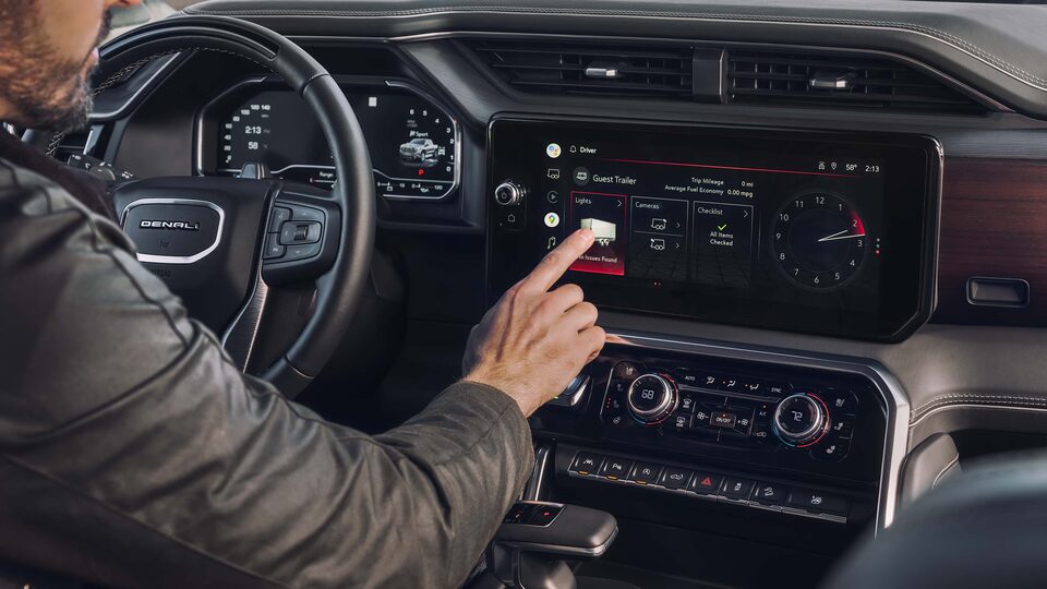 A Driver utilizing the Touch Screen Digital Display on the GMC Sierra LD