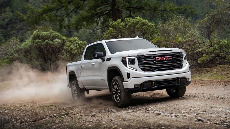 The Sierra AT4 Kicking Up Dirt on an Off-Road Trail