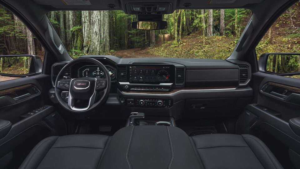 The Upgraded Interior of the Sierra 1500 with a View of the Forest