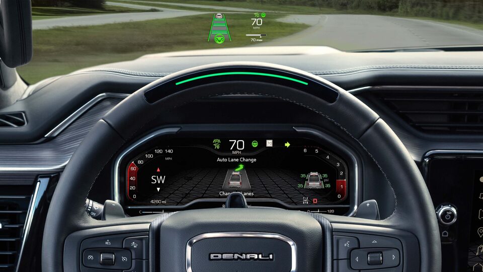 A Drivers View of the Steering Wheel and Heads-Up Display on the GMC Sierra LD