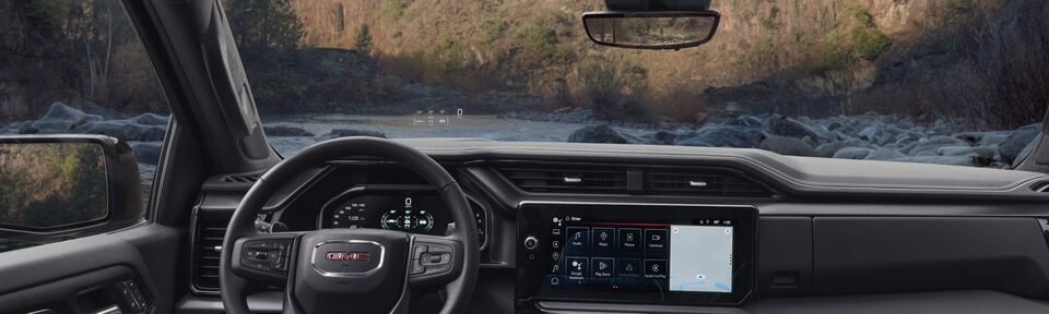 A Interior View of the Front Seats, Steering Wheel, and more on the GMC Sierra LD