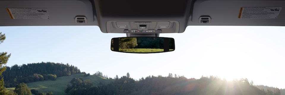 The Rearview Mirror of the GMC Sierra Displaying an Incredible View