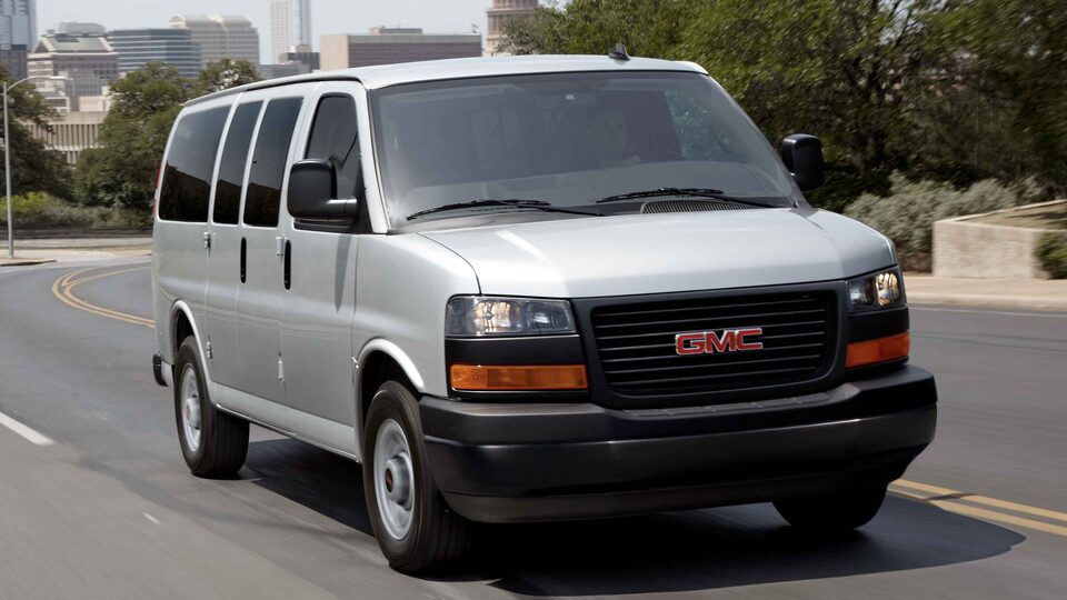 2023 GMC Savana Passenger Van Passengers side Exterior Three-Quarters view on road