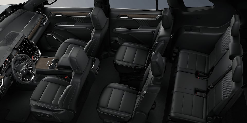 Wide Overhead View of the 3 Row Black Seating in a 2024 GMC Acadia Mid-Size SUV
