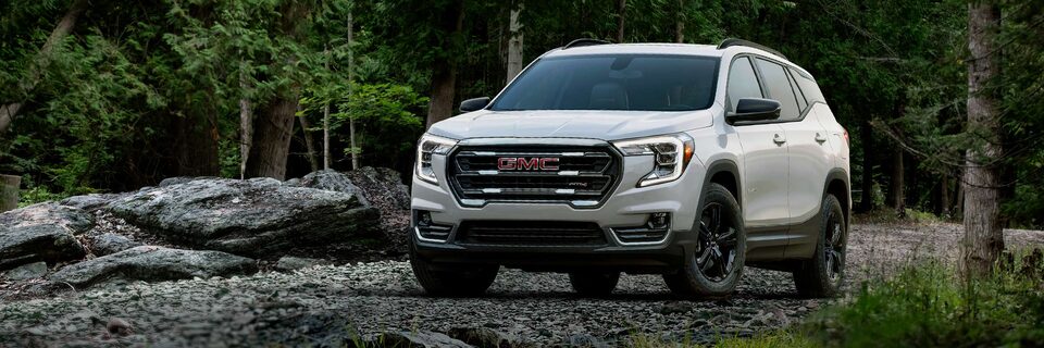 A White GMC Terrain Driving Off-Road