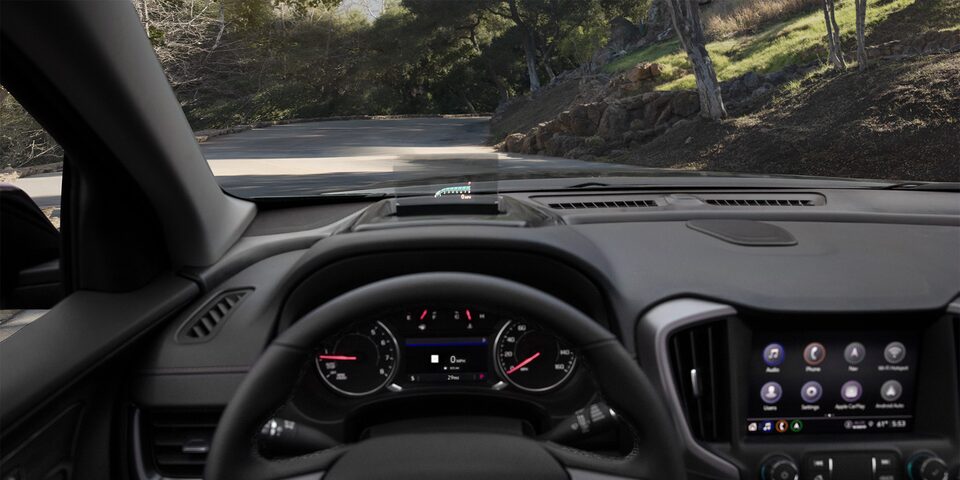 A Driver's View of the Steering Wheel and Head-Up Display of the GMC Terrain