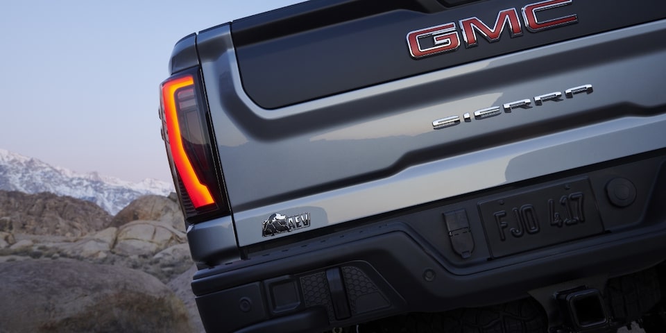 The Stunning Rear-End Design of the Sierra HD AT4 with the Iconic Sierra Badging Reflecting the Sun Light