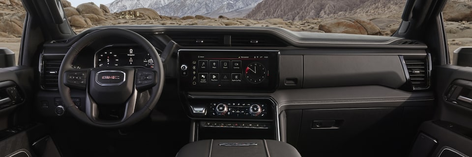 The Technology Packed Interior of the Sierra HD AT4 with a View of the Mountains
