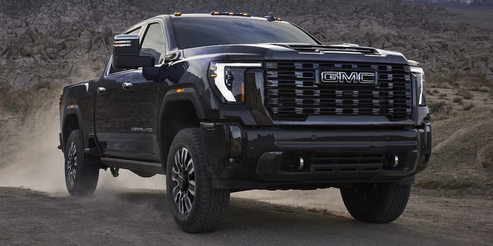  The Vader Chrome Sierra HD Denali Kicking up Dirt on an Off-Road Desert Trail