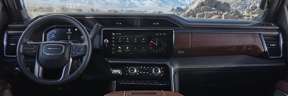 The Wood Accented Luxurious Trim of the Sierra HD Denali  with a Spectacular View of the Mountains