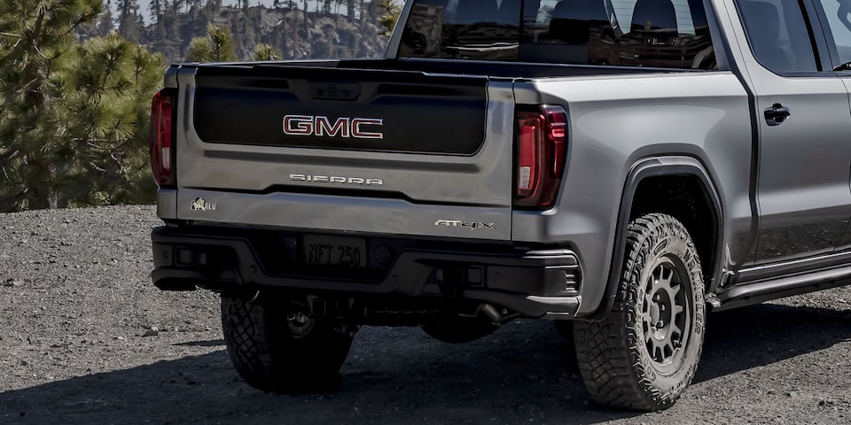 A Rear-Side View of a Parked GMC Sierra 1500 AT4