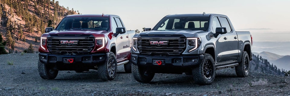 A Lineup of GMC Sierra LD AT4 Trims Parked