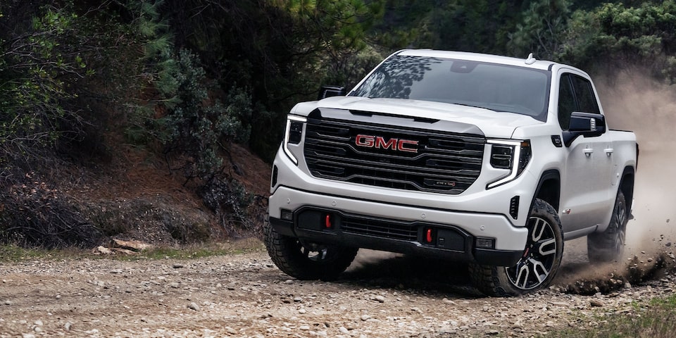 Image of the GMC Sierra 1500 AT4 Driving on a Curved Road