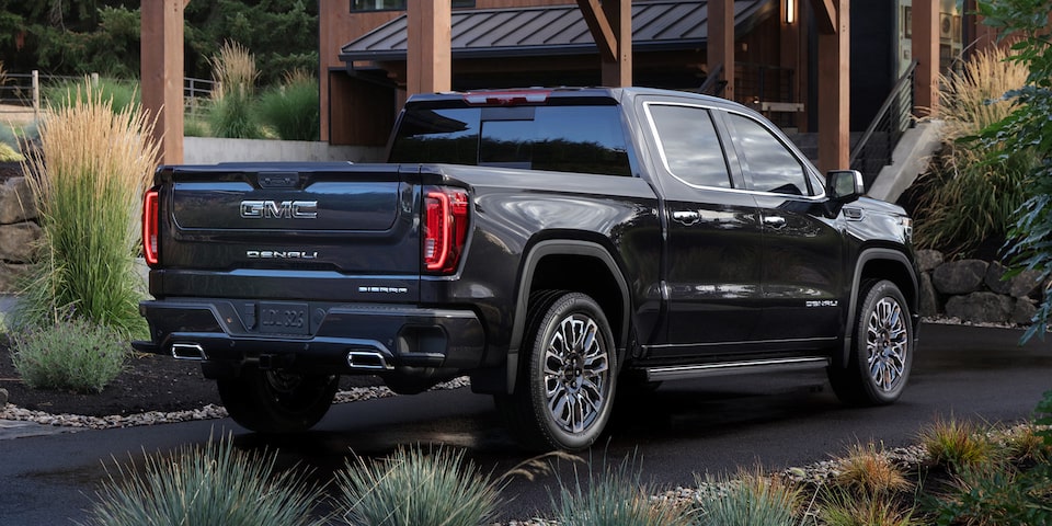 A Rear View Shot of the GMC Sierra LD Denali Parked in a Driveway