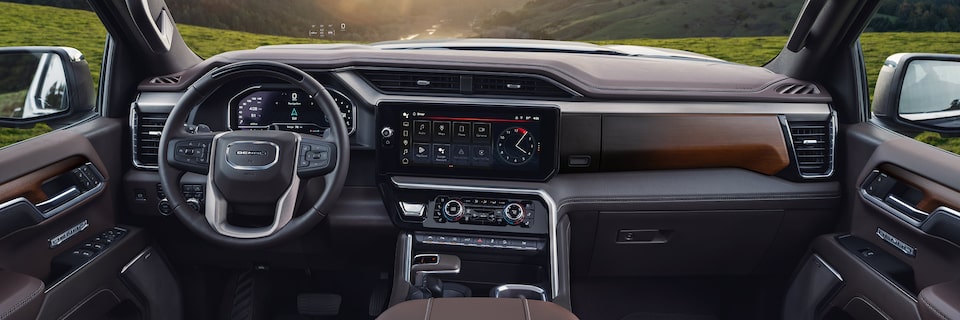 A Rear Passenger View of the Front Interior Cabin of the GMC Sierra LD Denali