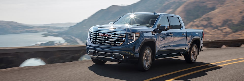 The GMC Sierra LD Denali Driving On-Road During the Day