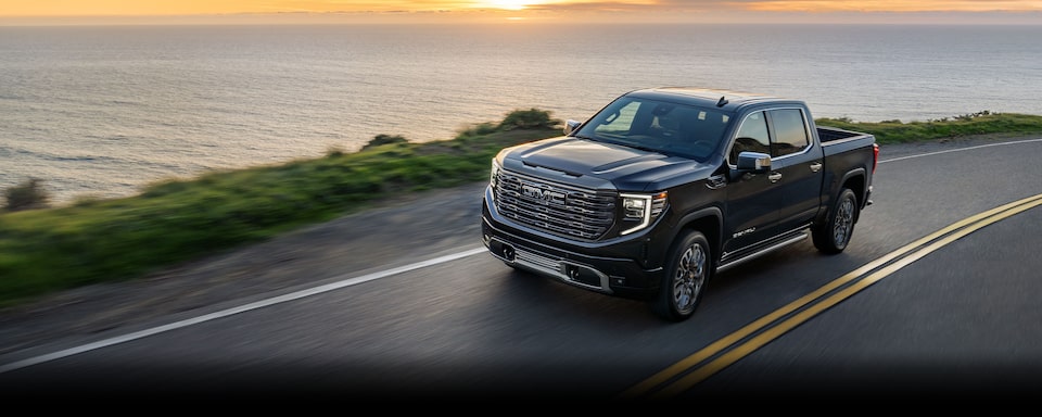 A GMC Sierra LD Driving On-Road on the Highway