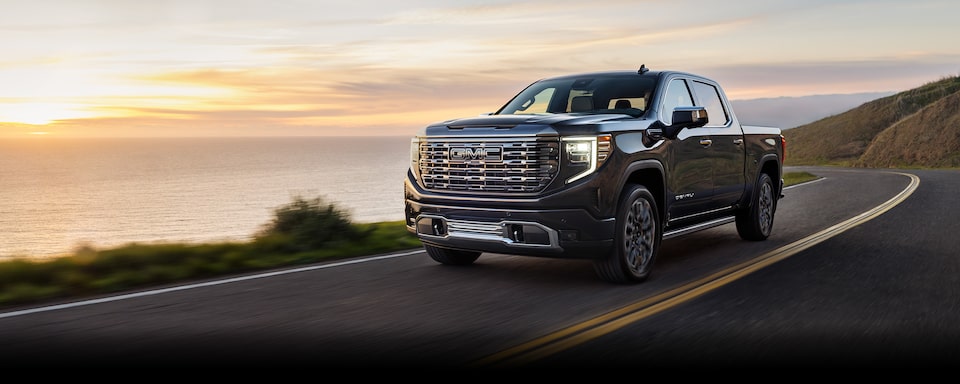 An Exterior Shot of the GMC Sierra LD Driving Off-Road