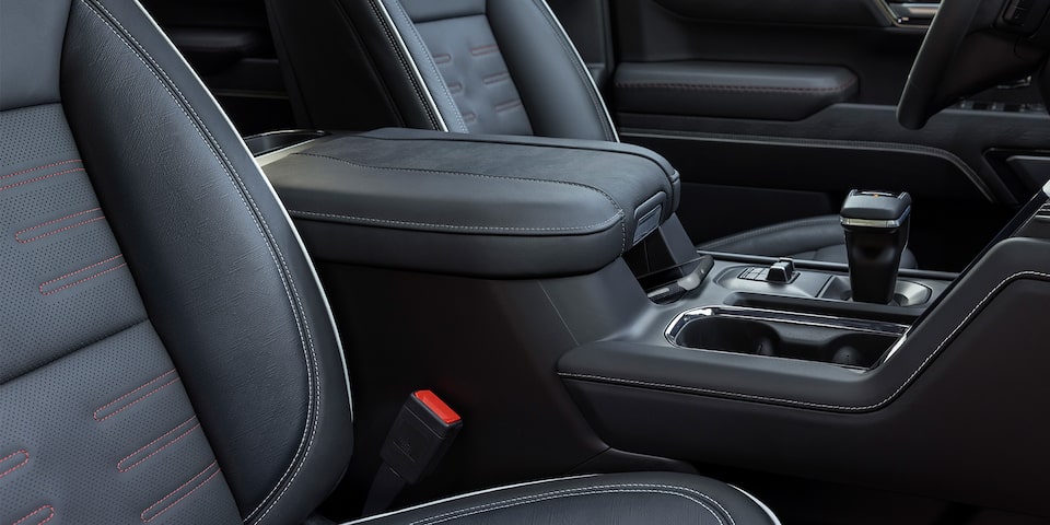 Close-up View of the Gray Seats and Middle Armrest Console of the 2024 GMC Sierra LD