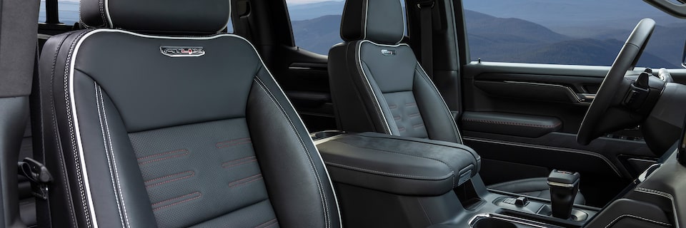 Interior Shot of the 2024 GMC Sierra LD Viewing the Passenger and Driver Leather Seats
