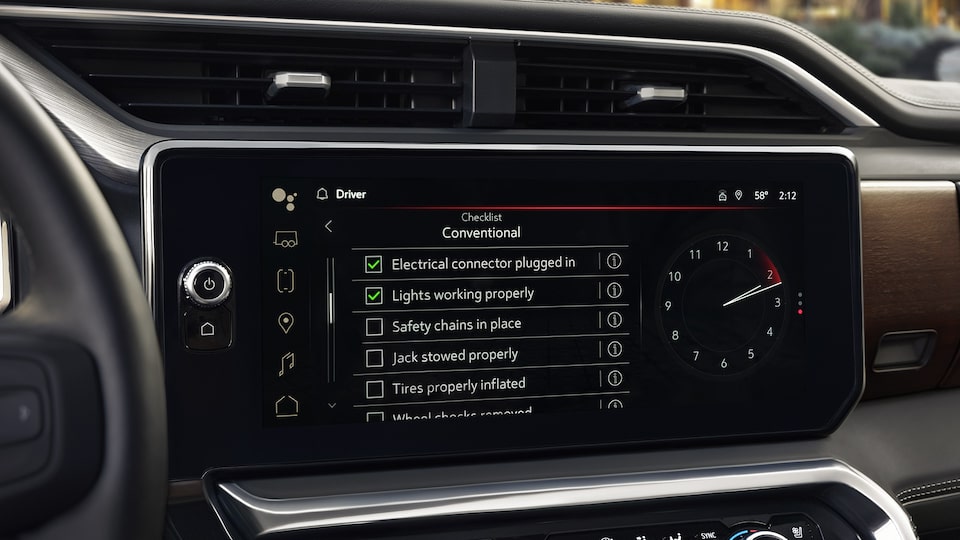 A Closeup on the Infotainment System of the 2024 GMC Sierra LD Displaying the Available Prograde Trailering System