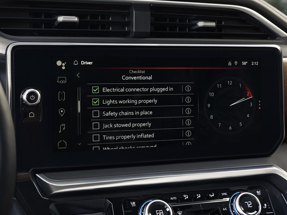 A Closeup on the Infotainment System of the 2024 GMC Sierra LD Displaying the Available Prograde Trailering System