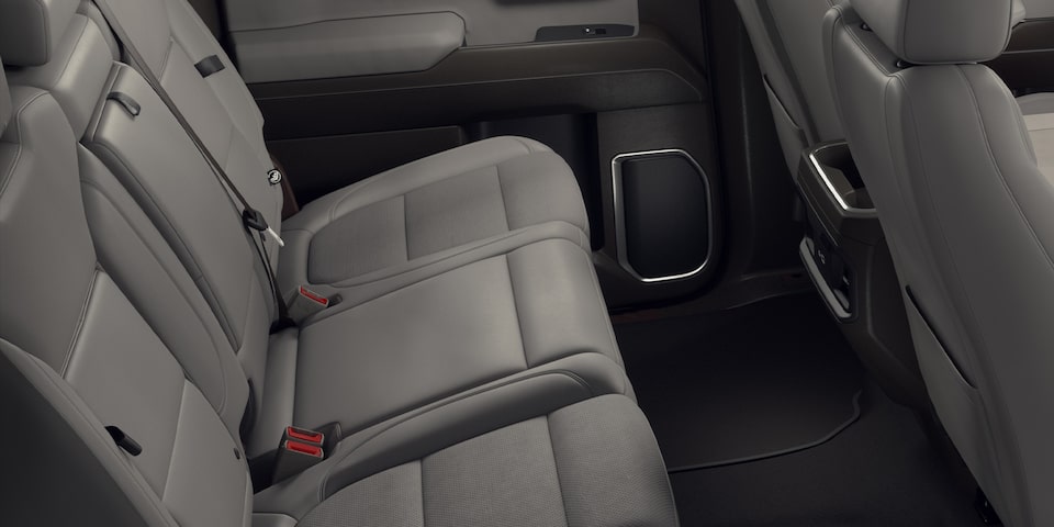 Side Interior View of the Gray Leather Back Row Seats of the 2024 GMC Sierra 1500 SLE
