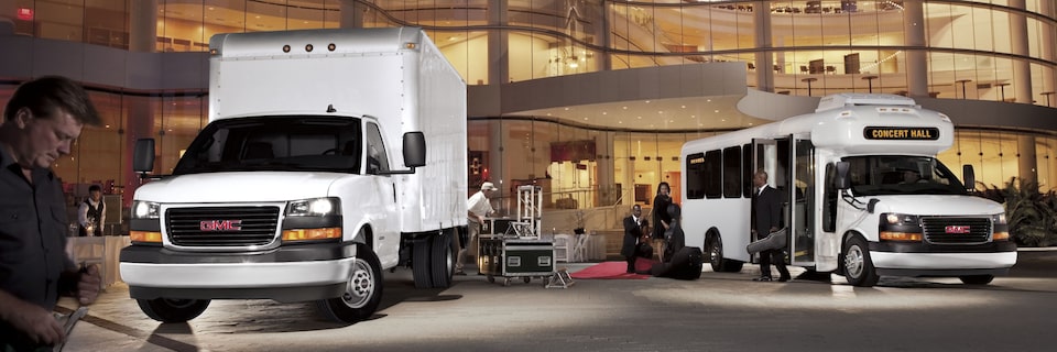 People Unloading Equipment from the GMC Savana Cutaway