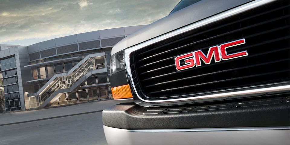 Close-Up on the Front Grille and GMC Nameplate on the GMC Savana Passenger