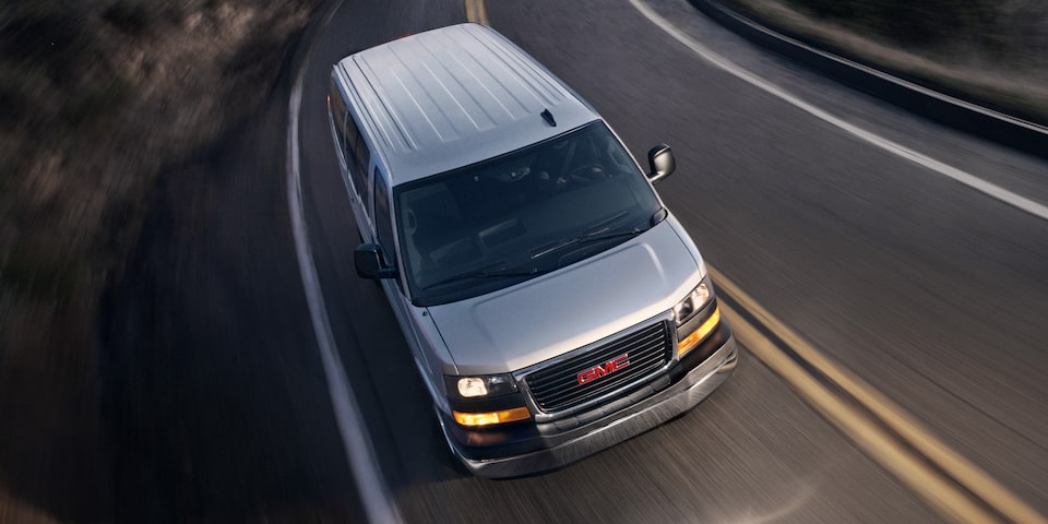The GMC Savana Passenger Driving On-Road At Night