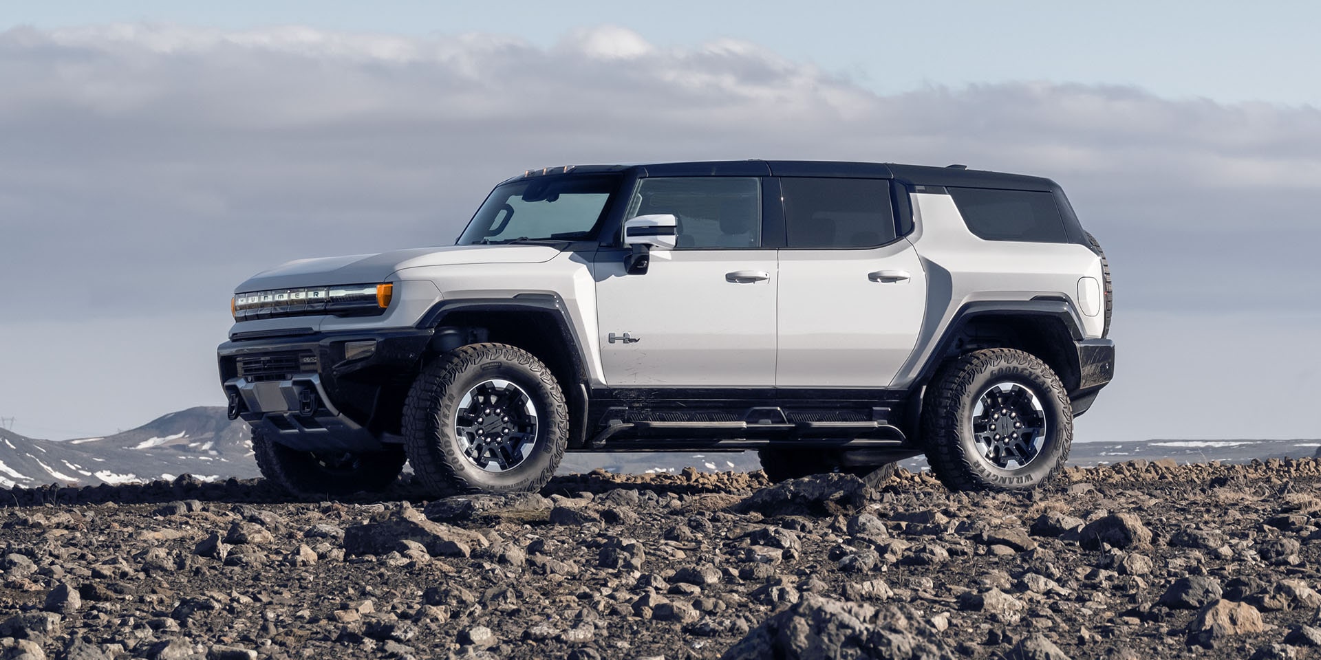 Hummer EV SUV parked on rocky terrain
