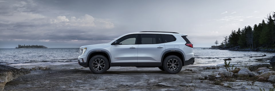 Profile View of the GMC Acadia AT4 Mid-Size Off-Road SUV Parked on the Beach