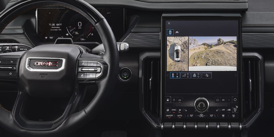 Interior View of the GMC Acadia AT4 Steering Wheel, Infotainment System, and Dashboard