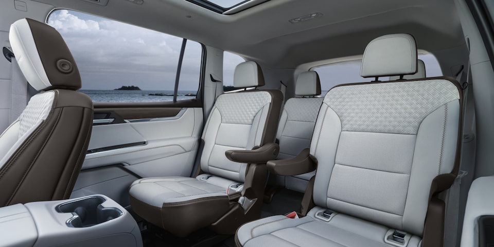 View of the White Interior Second and Third Row Seating in the GMC Acadia Denali SUV
