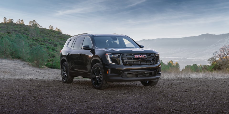 Front Three-Quarter View of the GMC Acadia Mid-Size SUV Parked Off-Road