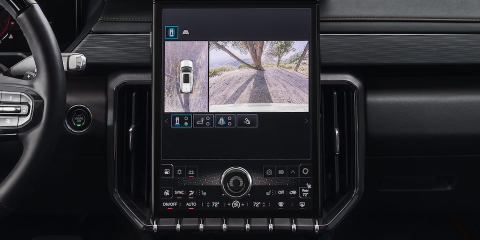 Interior View of the GMC Acadia Infotainment System Displaying the Trailering Guide and Camera View