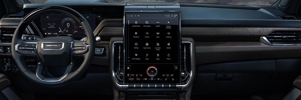 Drivers Side View of the Steering Wheel, Infotainment System and Dashboard in the GMC Yukon
