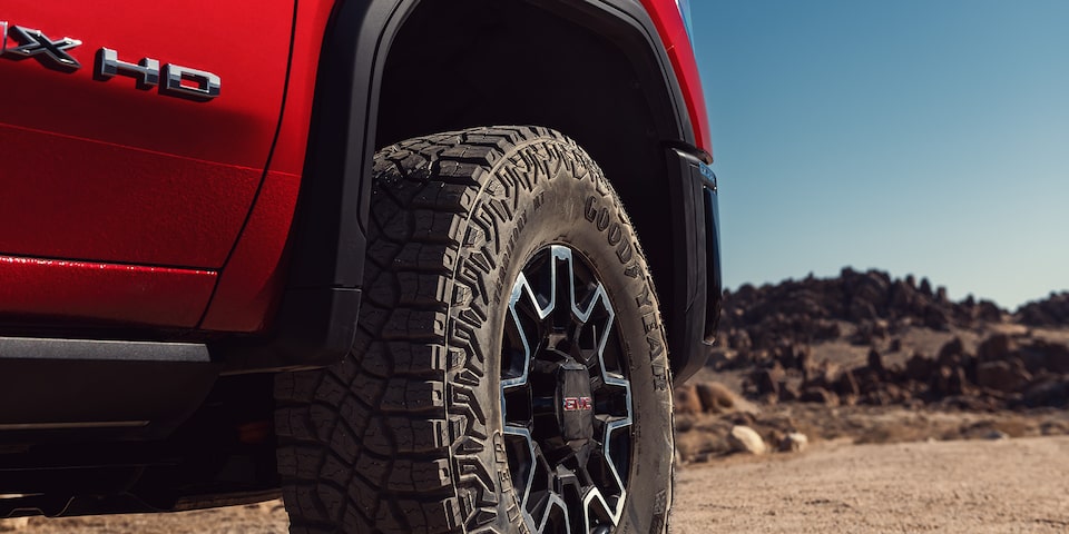 Close-up View of the "HD" Badging and Wheel on a 2025 GMC Sierra HD AT4 Truck