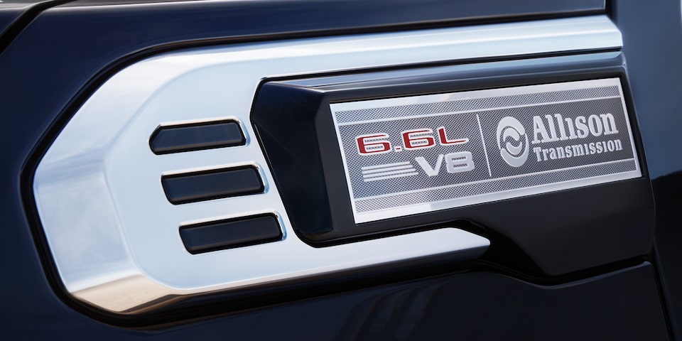 Close-up View of  "6.6 L V8" and "Allison Transmission" Badging on a GMC Truck