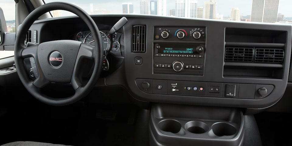 A Driver's View of the Front Interior of the GMC Savana Cargo Van