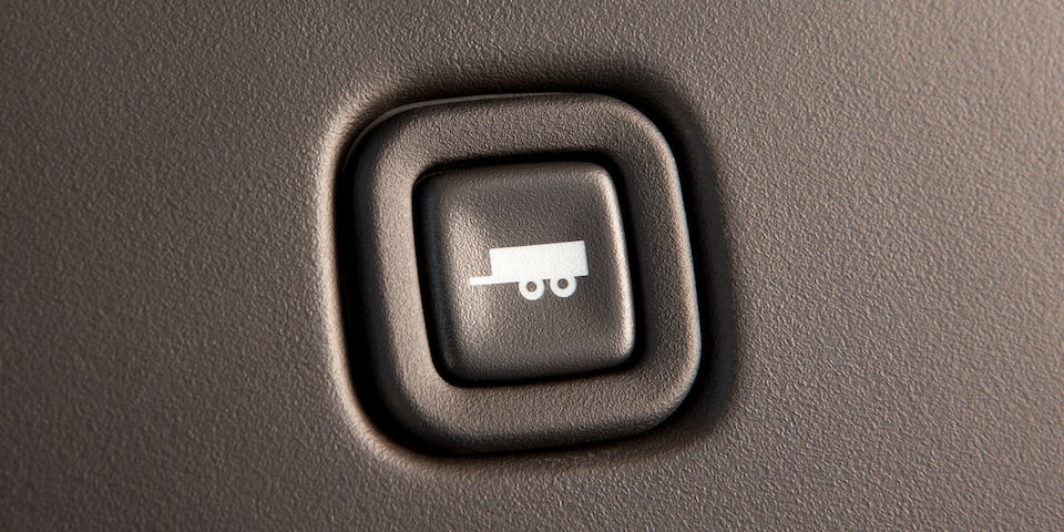 Close-Up of the Towing and Hauling Mode Button in a 2025 GMC Savana Passenger Van