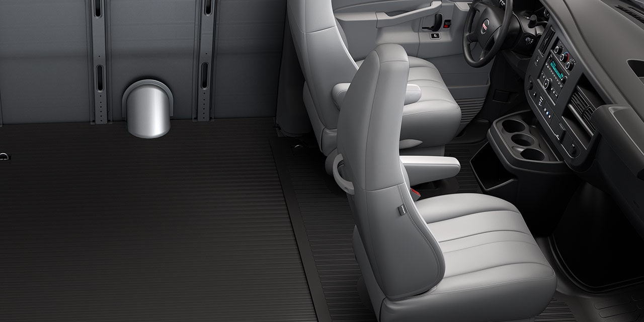Interior View of the Front Passenger Area of a 2026 GMC Savana Passenger Van with Gray Seats
