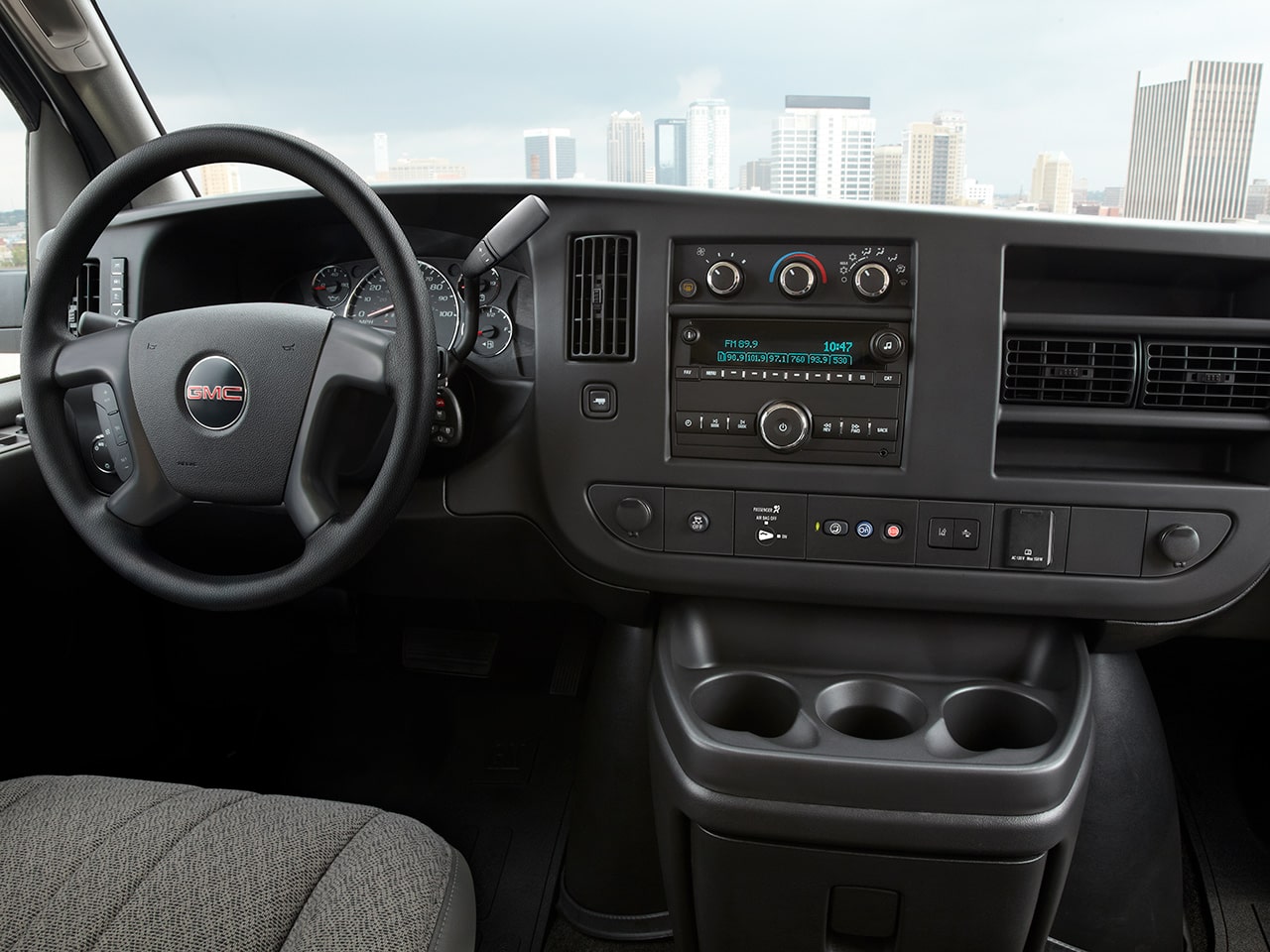 Wide Interior View of the Steering Wheel and Dashboard in a 2026 GMC Savana Cutaway Van