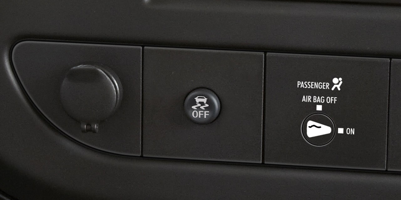 Close-Up of the Stabilitrak Button in a 2026 GMC Savana Passenger Van
