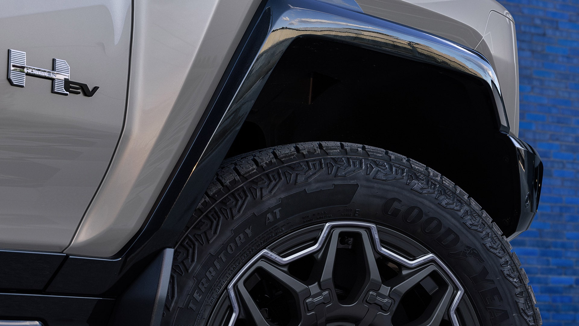 Close-up View of the 2026 GMC HUMMER EV SUV Logo on the Exterior near Tire