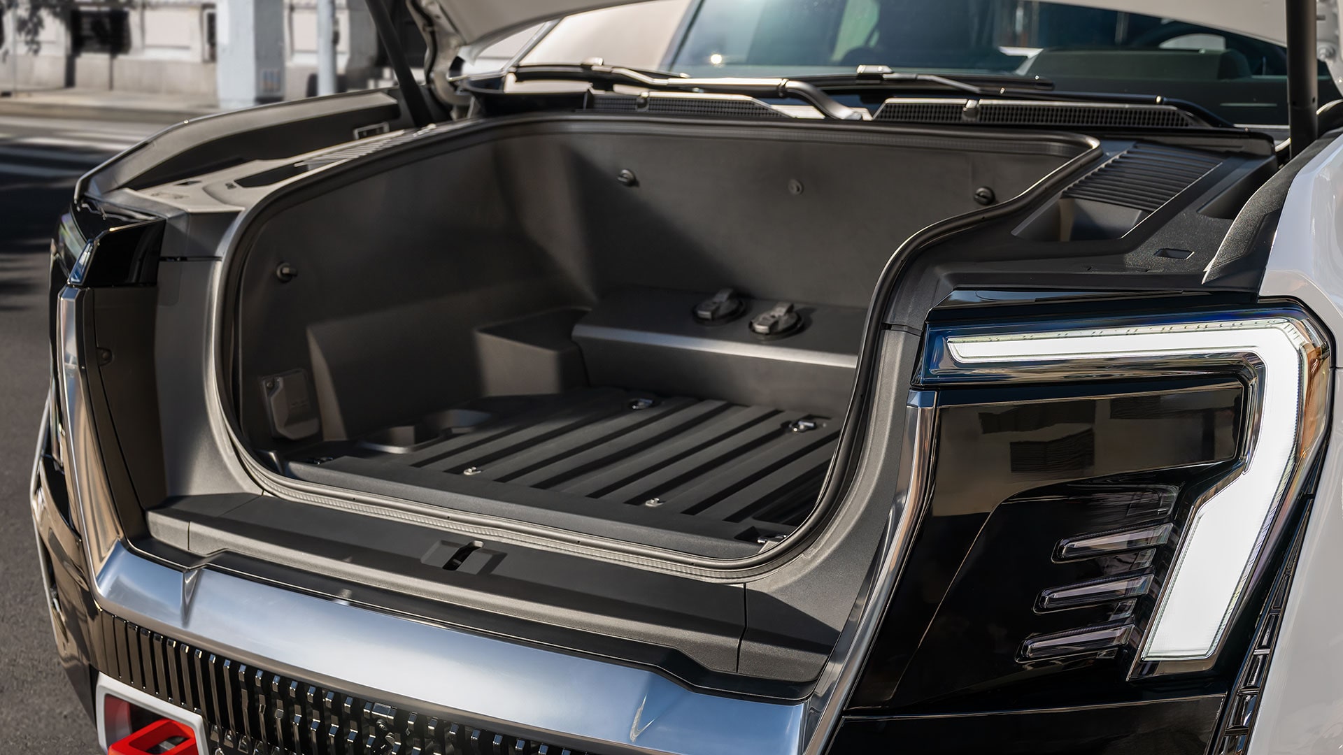 The Open Hook of the 2026 GMC Sierra EV AT4 Showing the Under-hood Storage