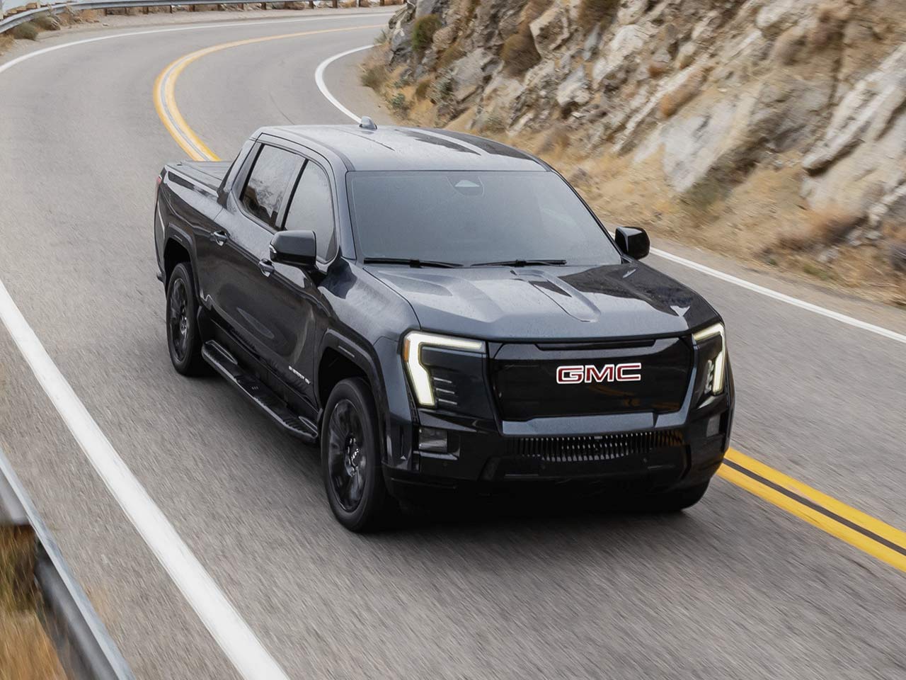 2026 gmc sierra ev passenger side front exterior view